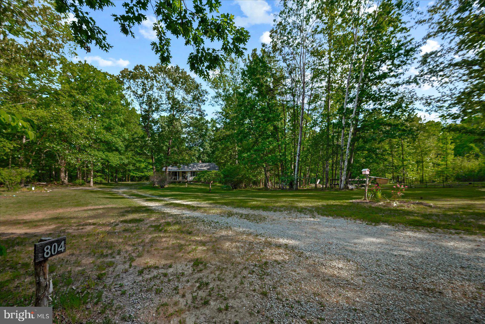 804 Buggy Lane Rochelle, VA 22738 - Photo 4 of 50 a view of a house in a yard with a large trees