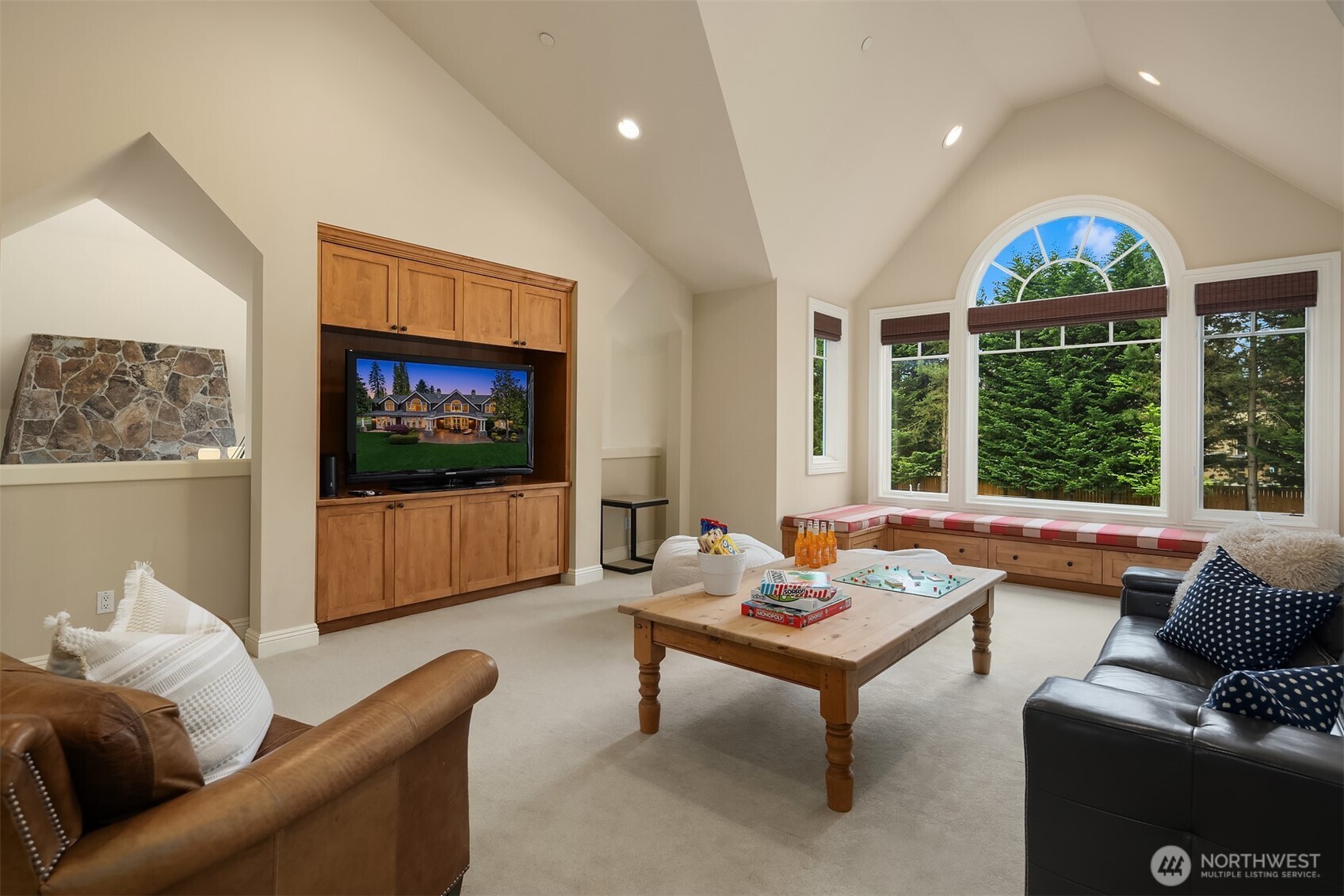 9 Diamond Ranch South Bellevue, WA 98004 - Photo 19 of 26 a living room with furniture a flat screen tv and a large window