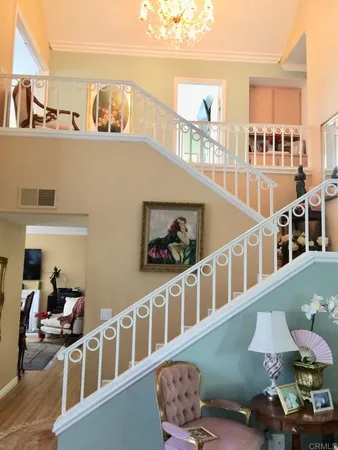 a front view of a house with lots of furniture and a window