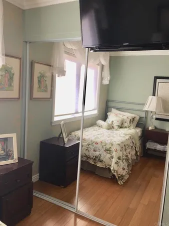 a bedroom with a bed and a couch