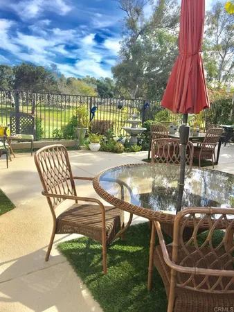 a view of a swimming pool with a patio