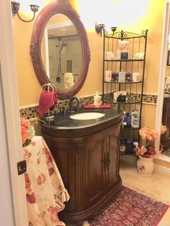 a bathroom with a sink and a mirror
