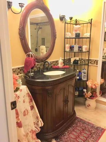 a bathroom with a sink and a mirror