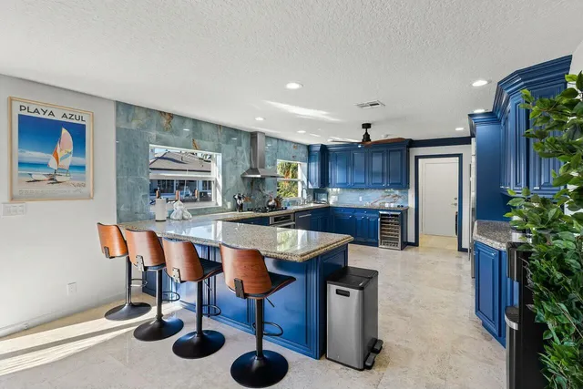 a living room with furniture a flat screen tv and potted plants
