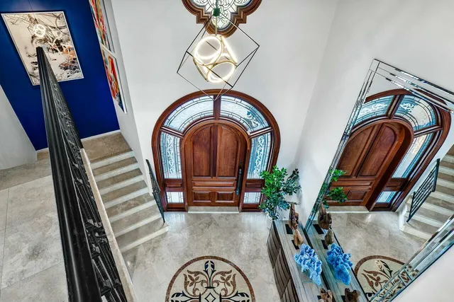 a view of a dining room with furniture and a potted plant