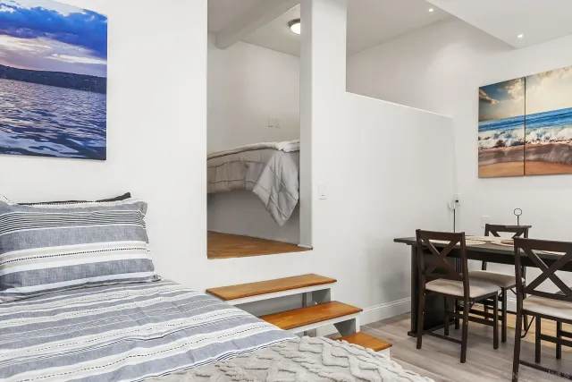 a bedroom with a bed and furniture