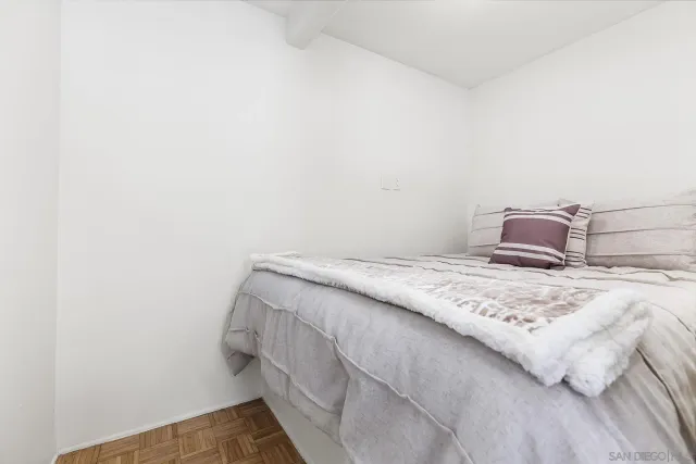 a bedroom with a bed and pillows