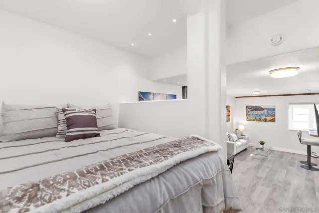 a bedroom with a bed and window