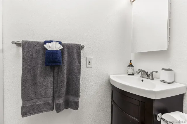 a bathroom with a sink and mirror