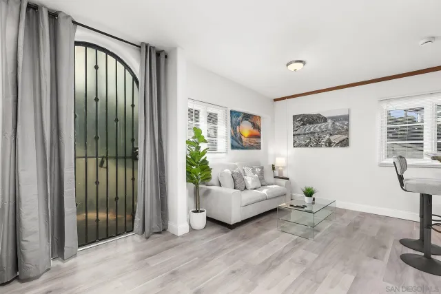 a living room with furniture and a window