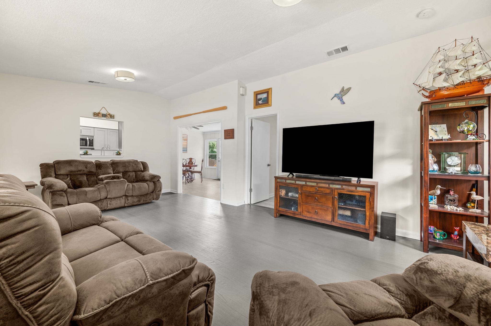 507 Gentian Road St. Augustine, FL 32086 - Photo 4 of 82 a living room with furniture and a flat screen tv