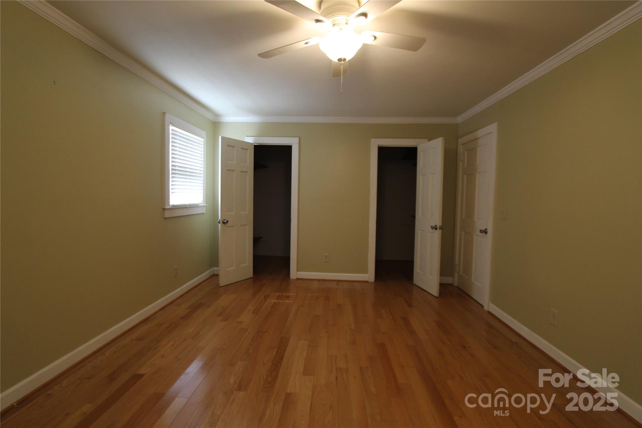 344 Lucas Road Star, NC 27356 - Photo 20 of 32 a view of an empty room with wooden floor and a window