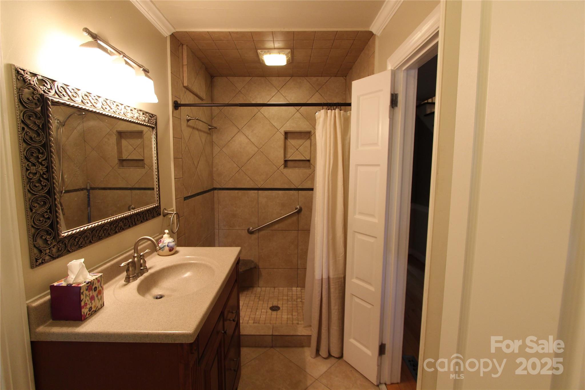 344 Lucas Road Star, NC 27356 - Photo 22 of 32 a bathroom with a sink and a mirror