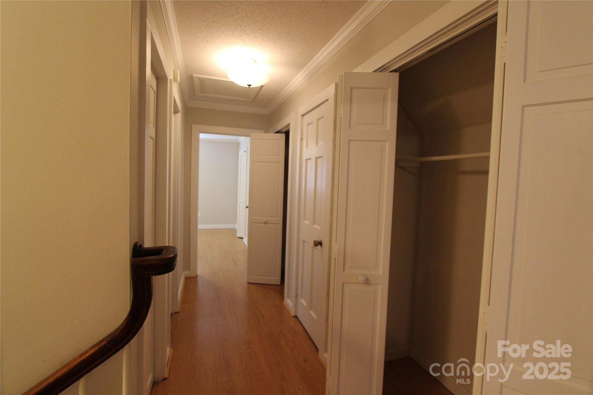 344 Lucas Road Star, NC 27356 - Photo 25 of 32 a view of a hallway with wooden floor and a bathroom