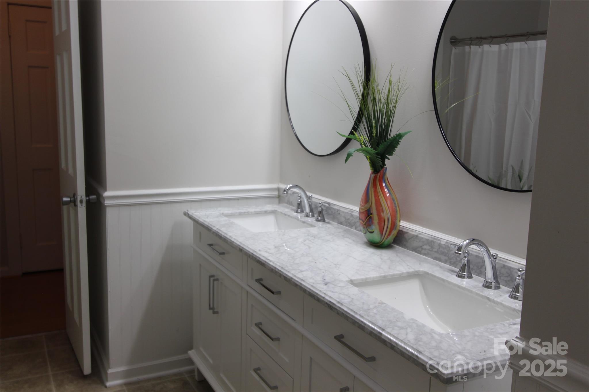 344 Lucas Road Star, NC 27356 - Photo 26 of 32 a bathroom with a granite countertop sink and a mirror