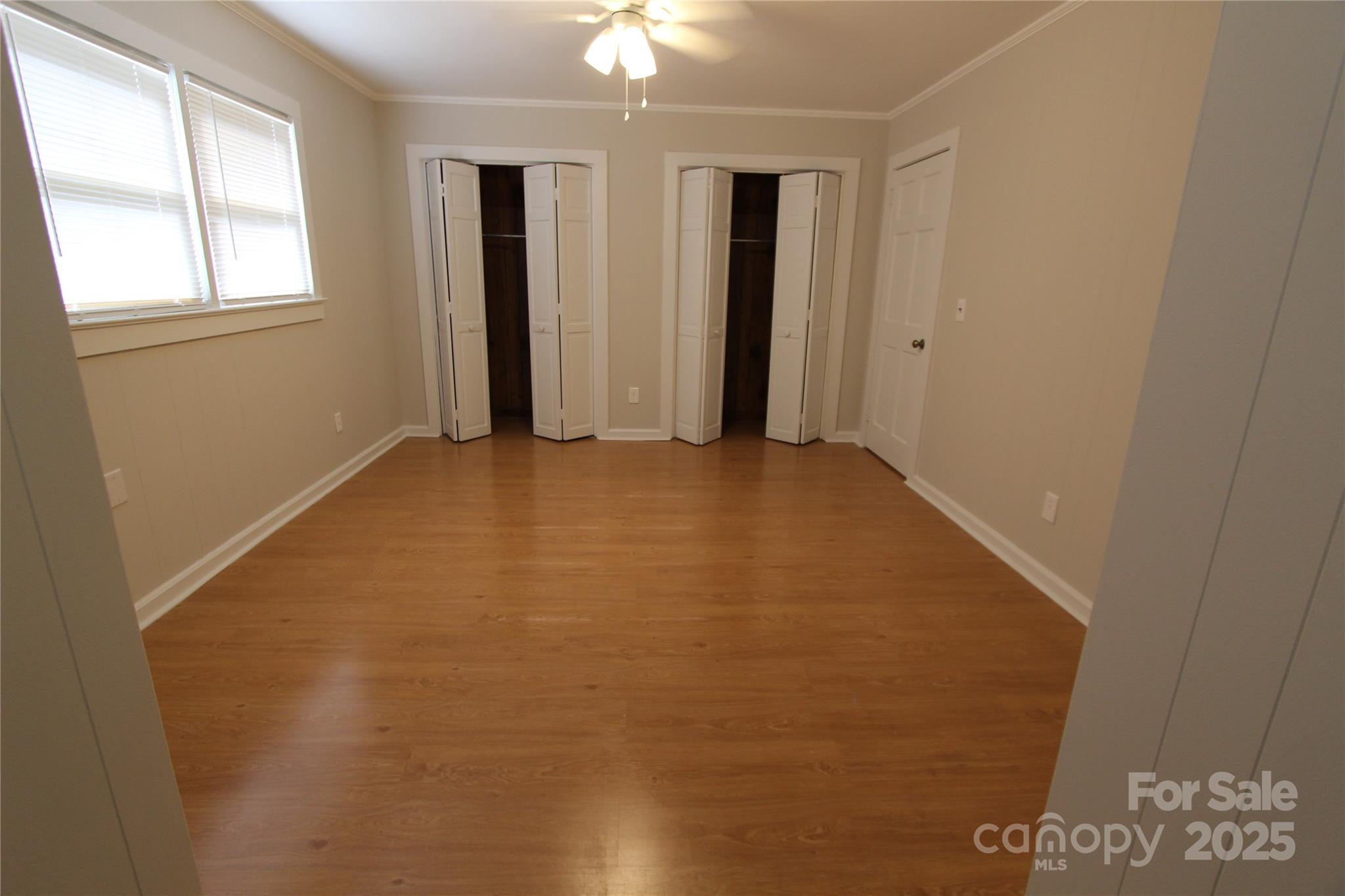 344 Lucas Road Star, NC 27356 - Photo 29 of 32 an empty room with windows and closet