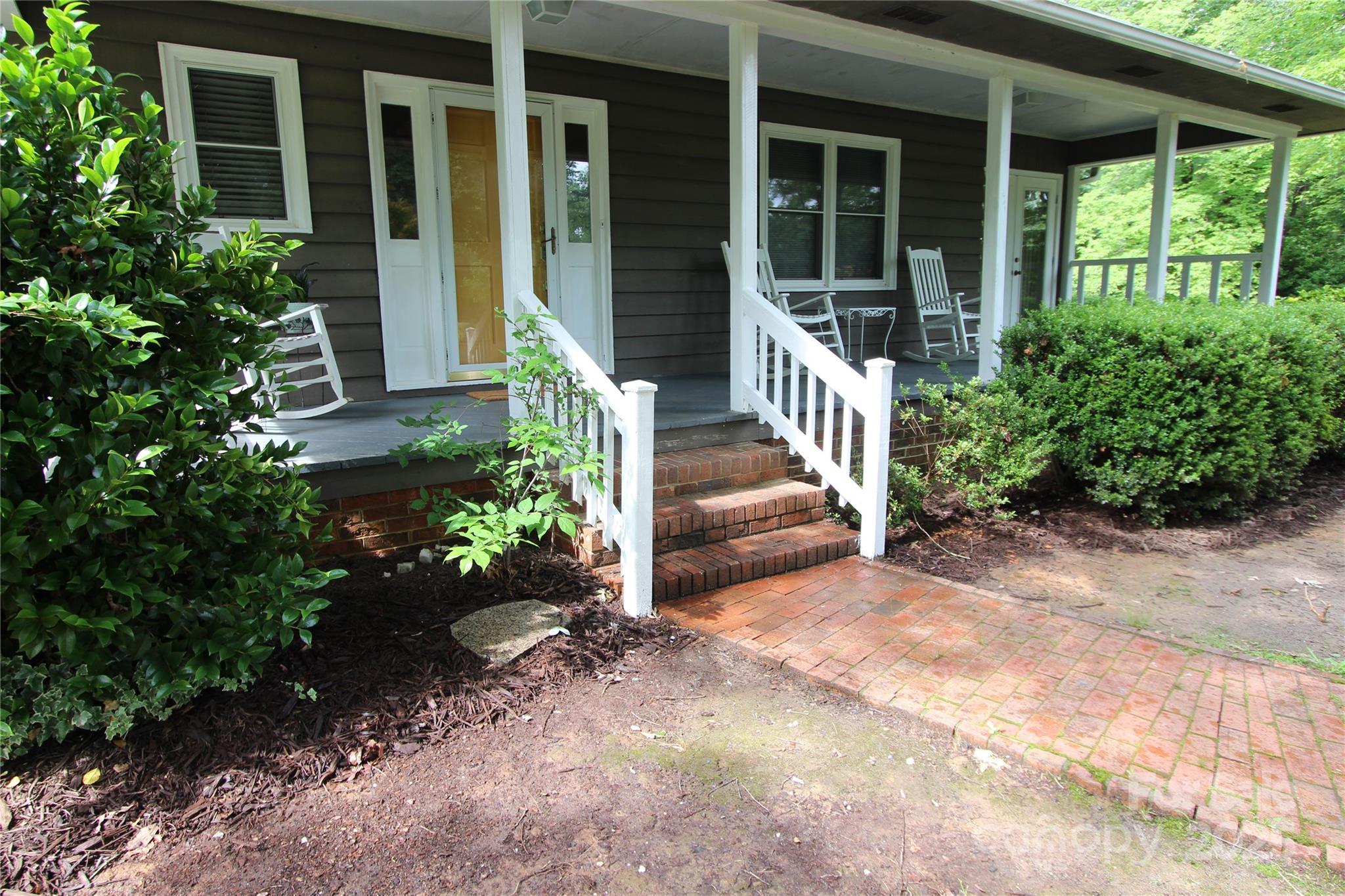 344 Lucas Road Star, NC 27356 - Photo 3 of 32 a front view of a house with a yard
