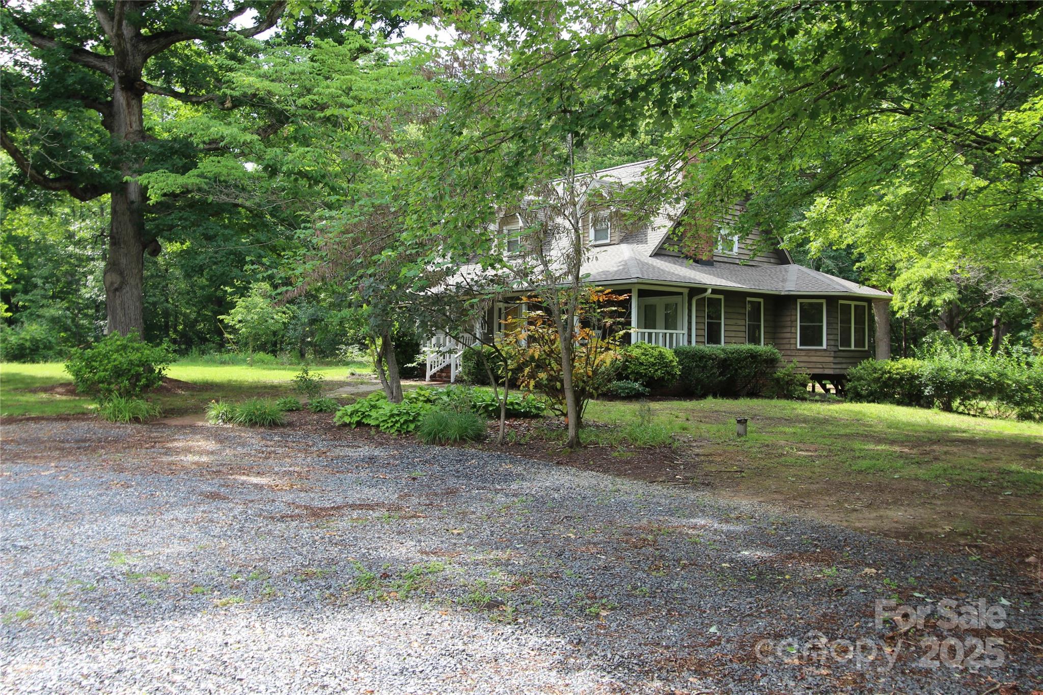 344 Lucas Road Star, NC 27356 - Photo 5 of 32 a front view of a house with a yard