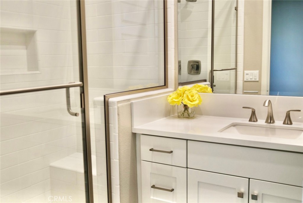 109 Pitch Irvine, CA 92618 - Photo 6 of 14 a bathroom with a granite countertop sink and a mirror