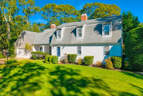 front view of a house with a yard