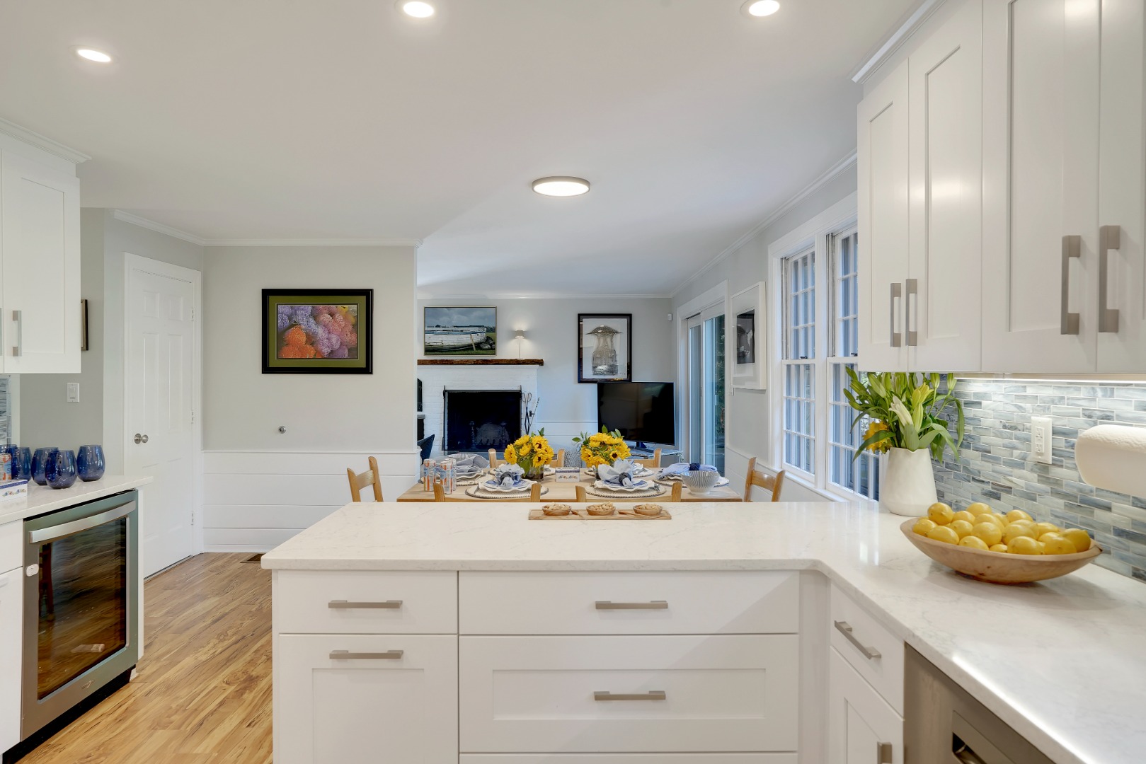 28 Pine Tree Lane Vineyard Haven, MA 02568 - Photo 19 of 61 a view of a kitchen with kitchen island a stove and a wooden floors