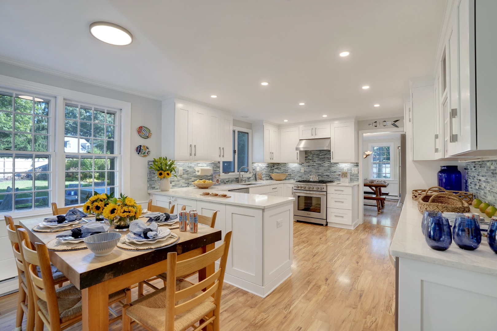28 Pine Tree Lane Vineyard Haven, MA 02568 - Photo 22 of 61 a kitchen that has a lot of cabinets a sink and a stove in it