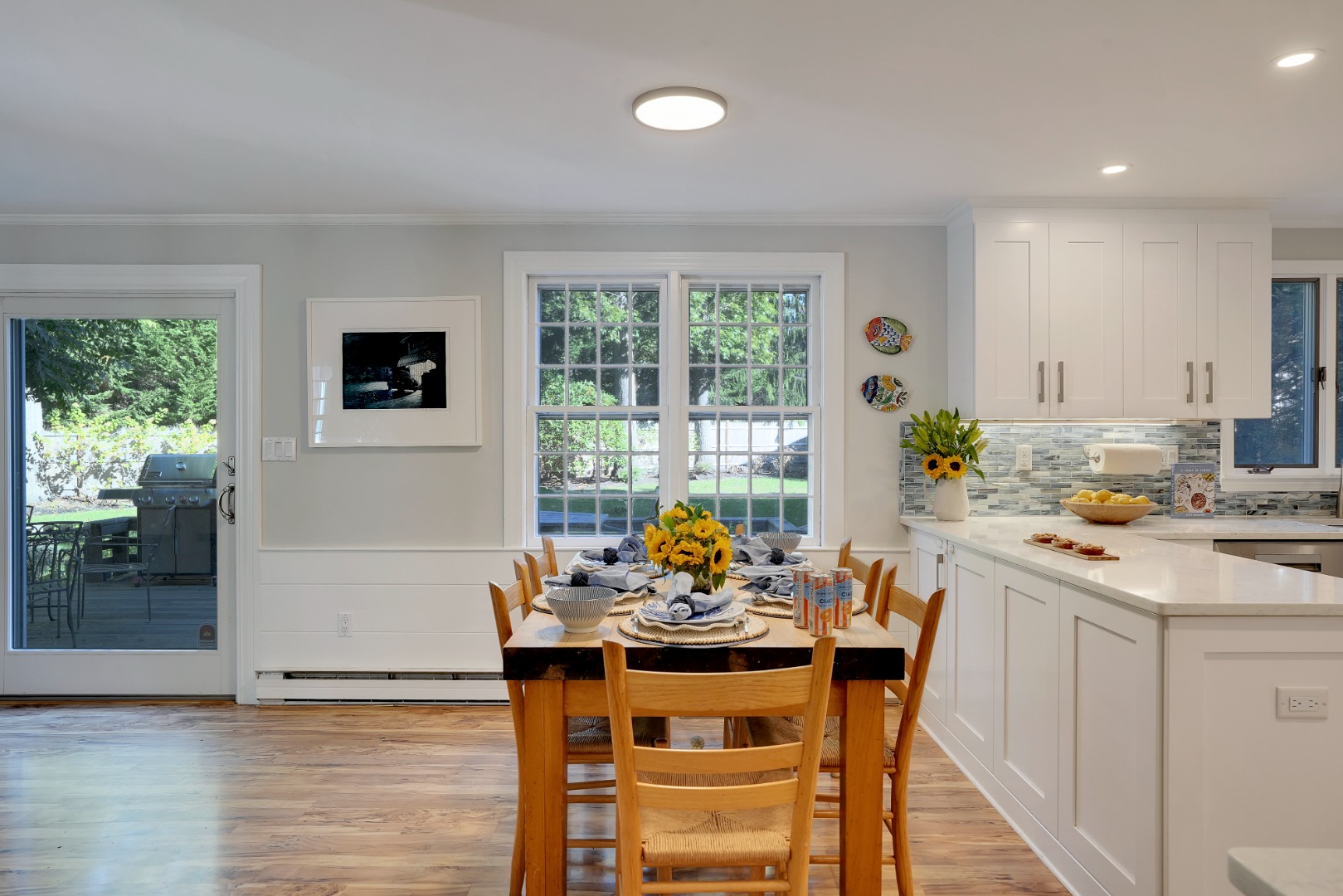 28 Pine Tree Lane Vineyard Haven, MA 02568 - Photo 23 of 61 a dining room with furniture a window and a kitchen view