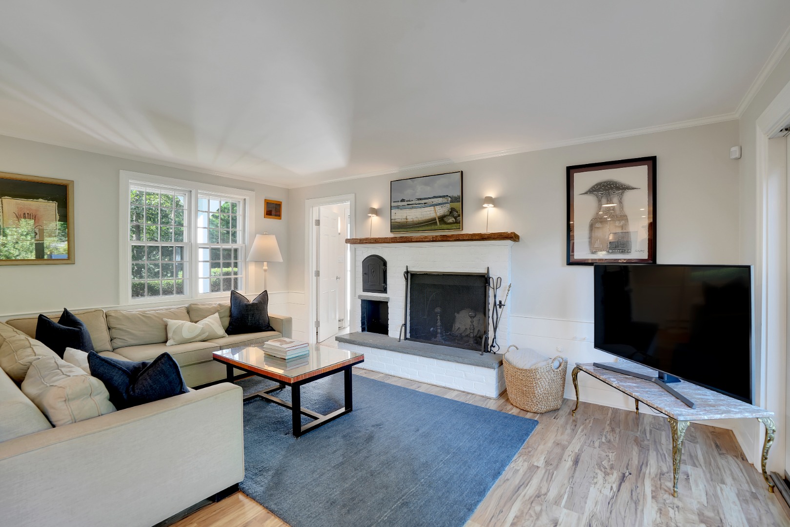 28 Pine Tree Lane Vineyard Haven, MA 02568 - Photo 28 of 61 a living room with furniture a flat screen tv and a fireplace