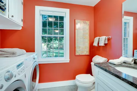 a view of living room kitchen with furniture and a fireplace