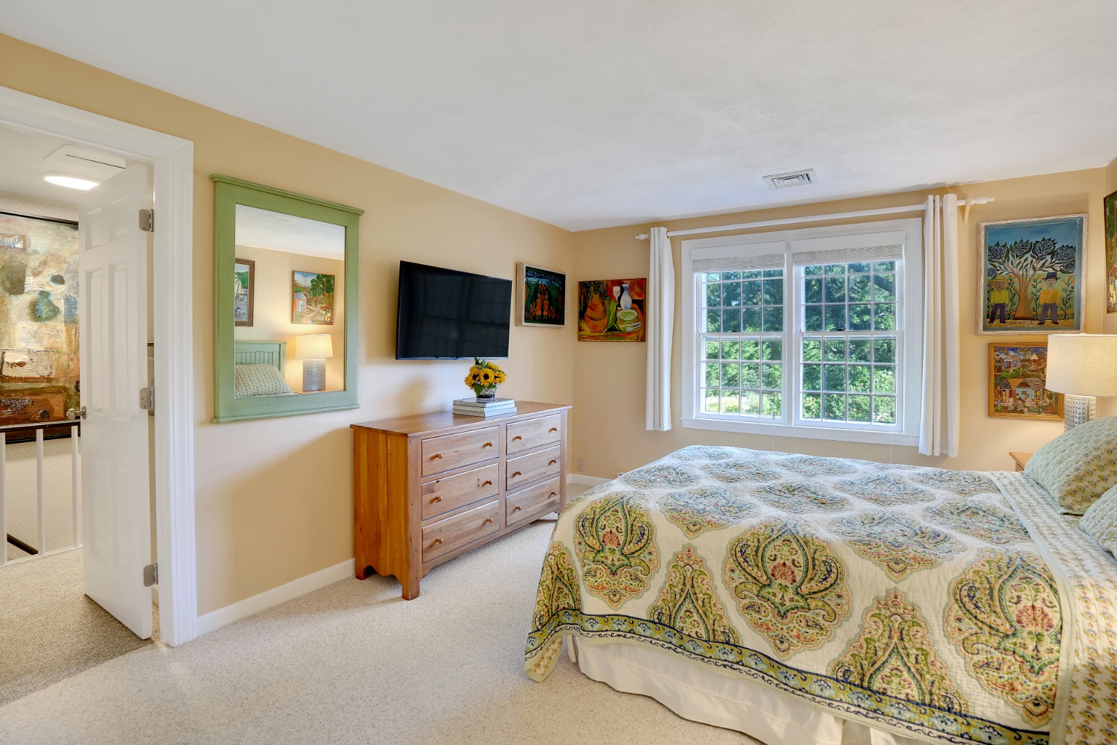 28 Pine Tree Lane Vineyard Haven, MA 02568 - Photo 38 of 61 a bedroom with a bed and flat tv screen next to a window