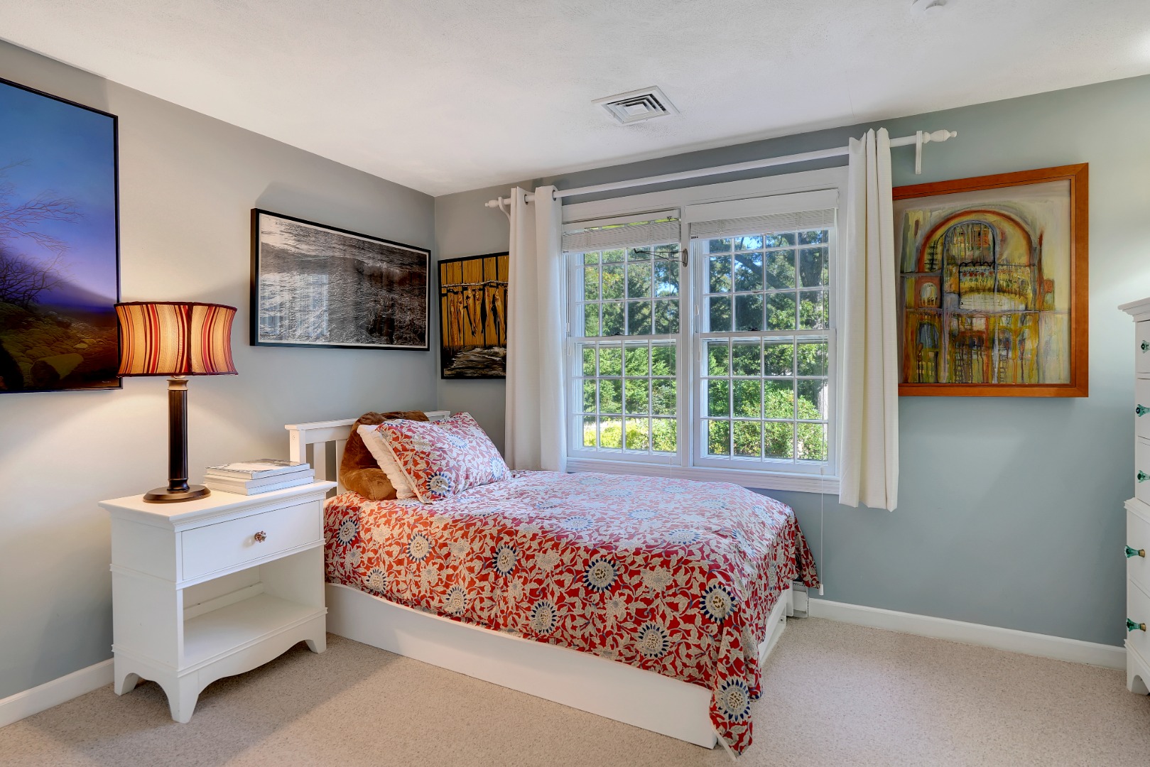 28 Pine Tree Lane Vineyard Haven, MA 02568 - Photo 42 of 61 a bedroom with a bed and lamp