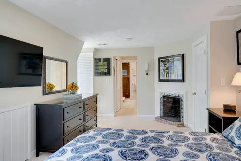 a front view of a house with yard and green space