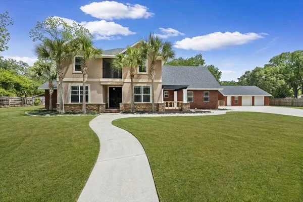 a view of a house with a big yard