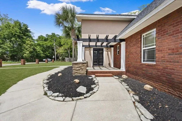 a backyard of a house with lots of green space