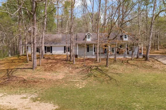 a backyard of a house with lots of green space