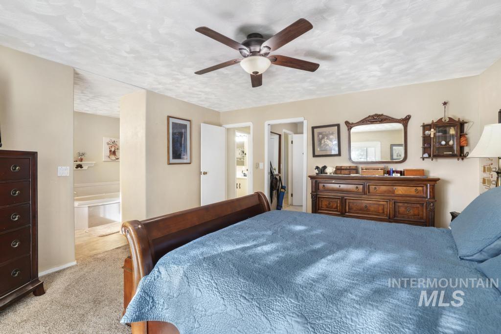 213 Sage Road West Jerome, ID 83338 - Photo 28 of 50 Carpeted bedroom featuring a textured ceiling and ceiling fan