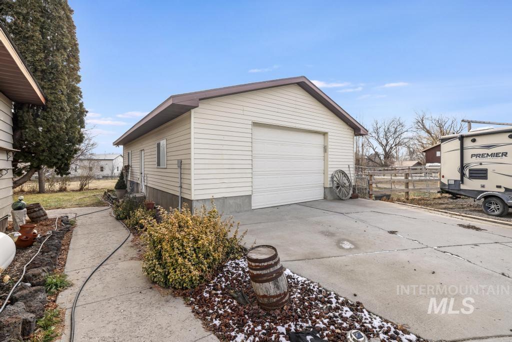 213 Sage Road West Jerome, ID 83338 - Photo 3 of 50 Detached heated and insulated fully finished shop featuring concrete floors 8.5x12.5 automatic door, LED lighting