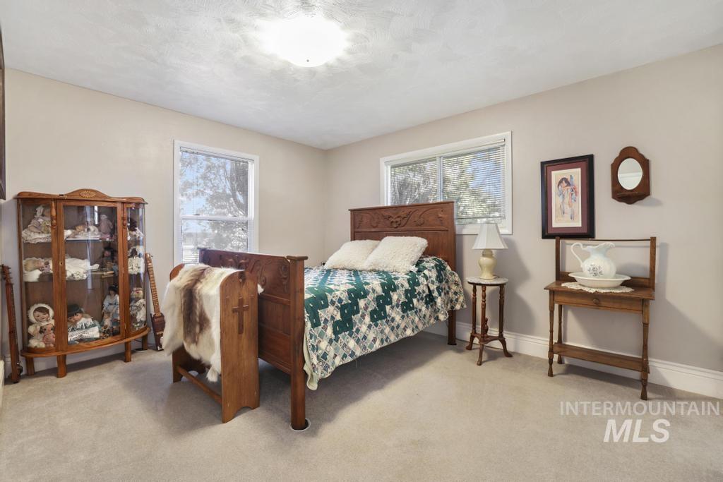 213 Sage Road West Jerome, ID 83338 - Photo 33 of 50 Bedroom with light carpet