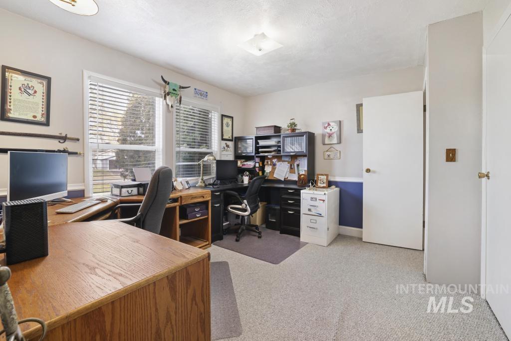 213 Sage Road West Jerome, ID 83338 - Photo 36 of 50 Home office with light colored carpet and baseboards