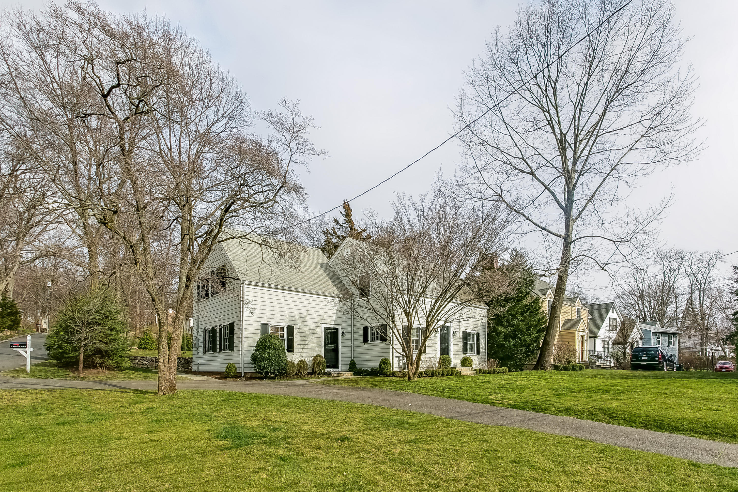 2 Miller Road Darien, CT 06820 - Photo 1 of 28 a brick building with trees in front of it