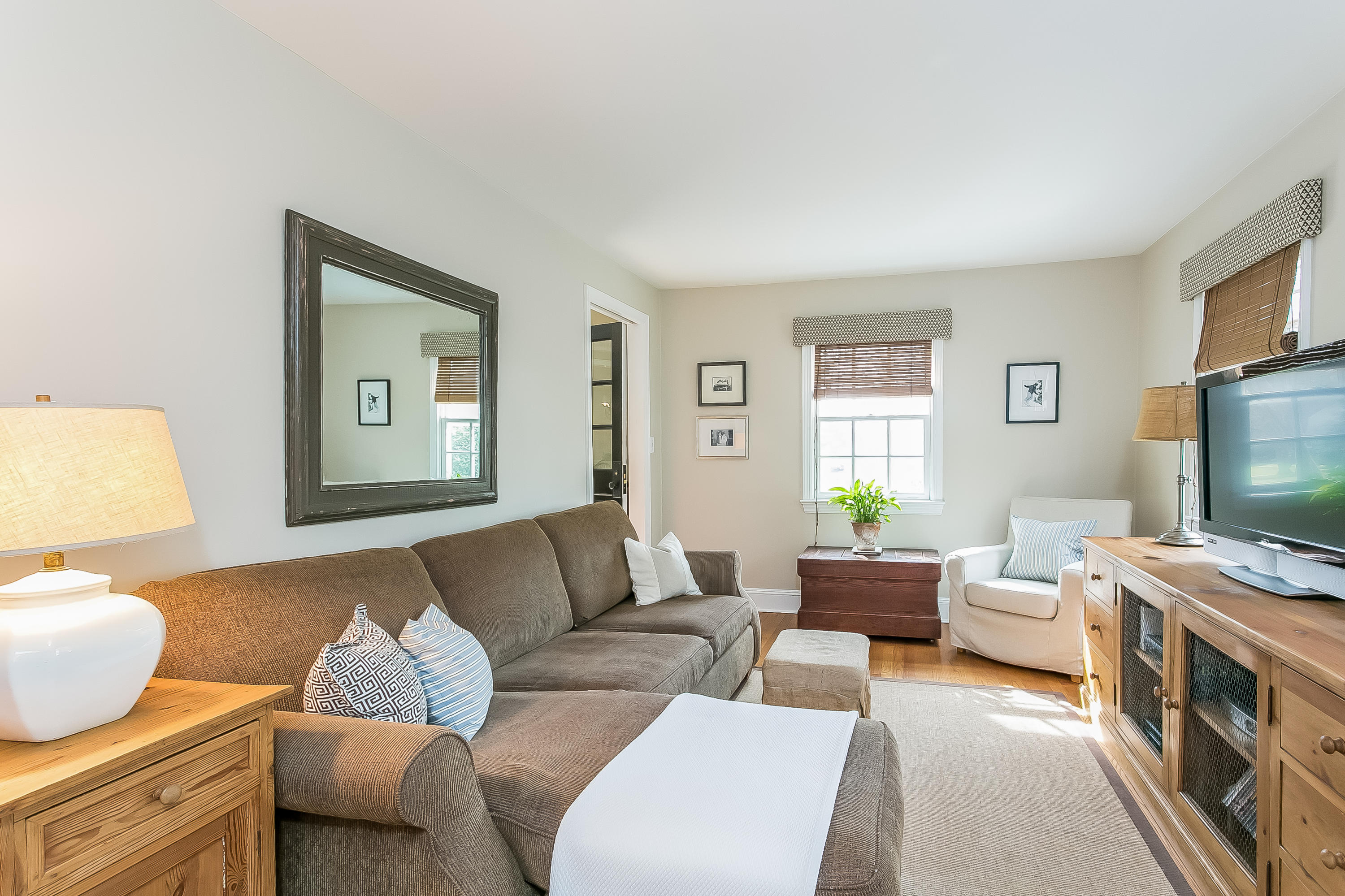 2 Miller Road Darien, CT 06820 - Photo 13 of 28 a living room with furniture and a flat screen tv