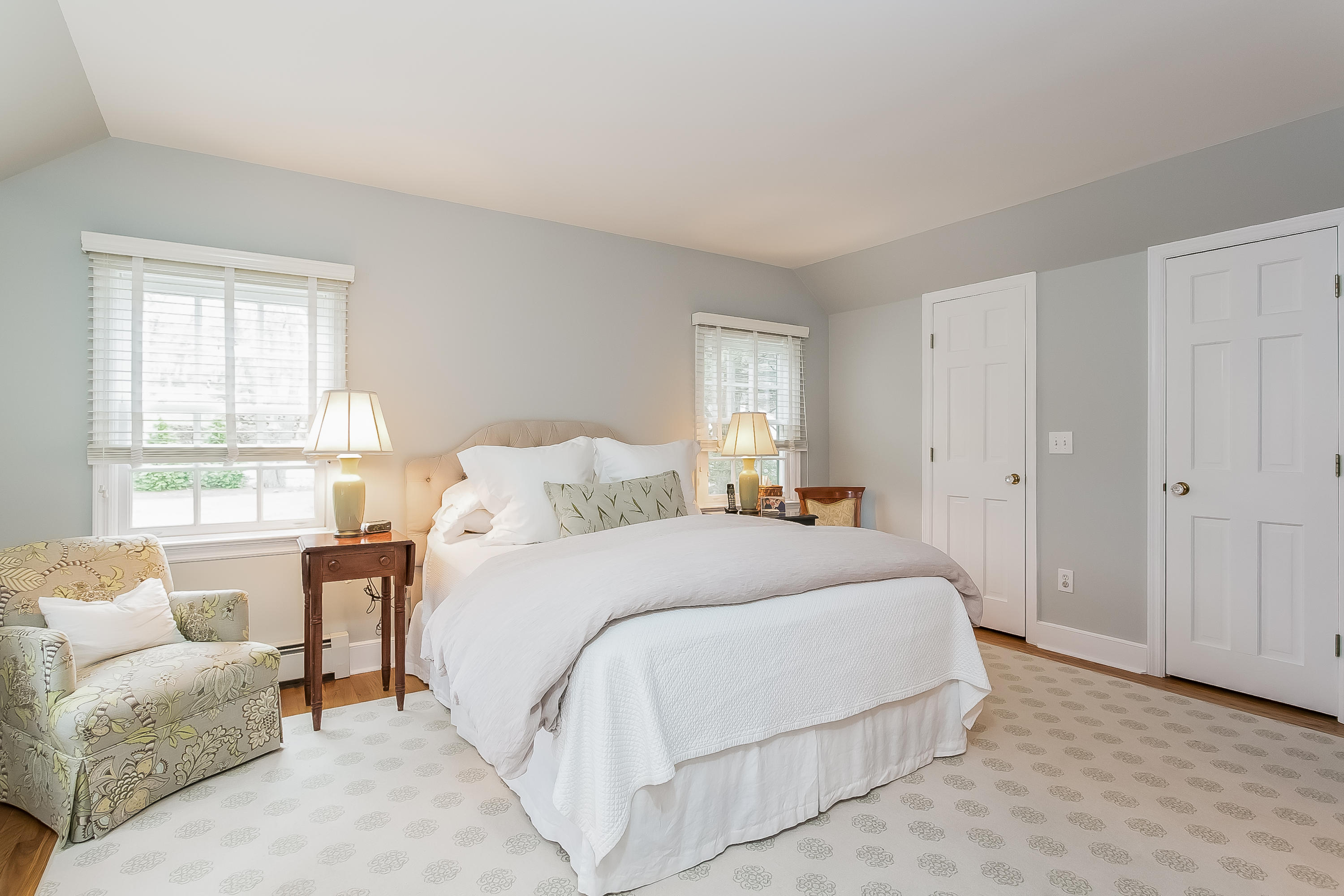 2 Miller Road Darien, CT 06820 - Photo 16 of 28 a bedroom with a bed and a couch with window