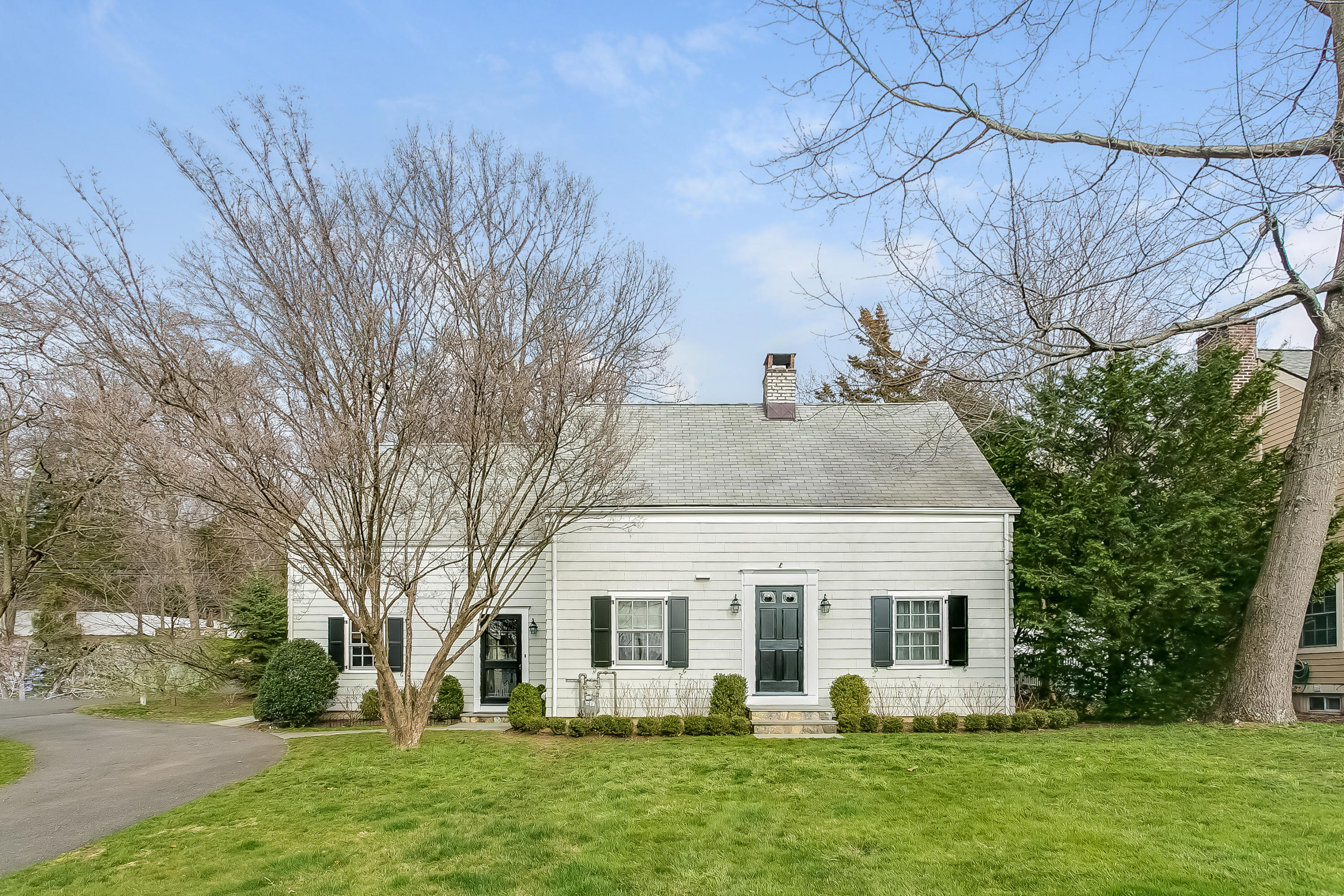 2 Miller Road Darien, CT 06820 - Photo 2 of 28 front view of a house with a yard
