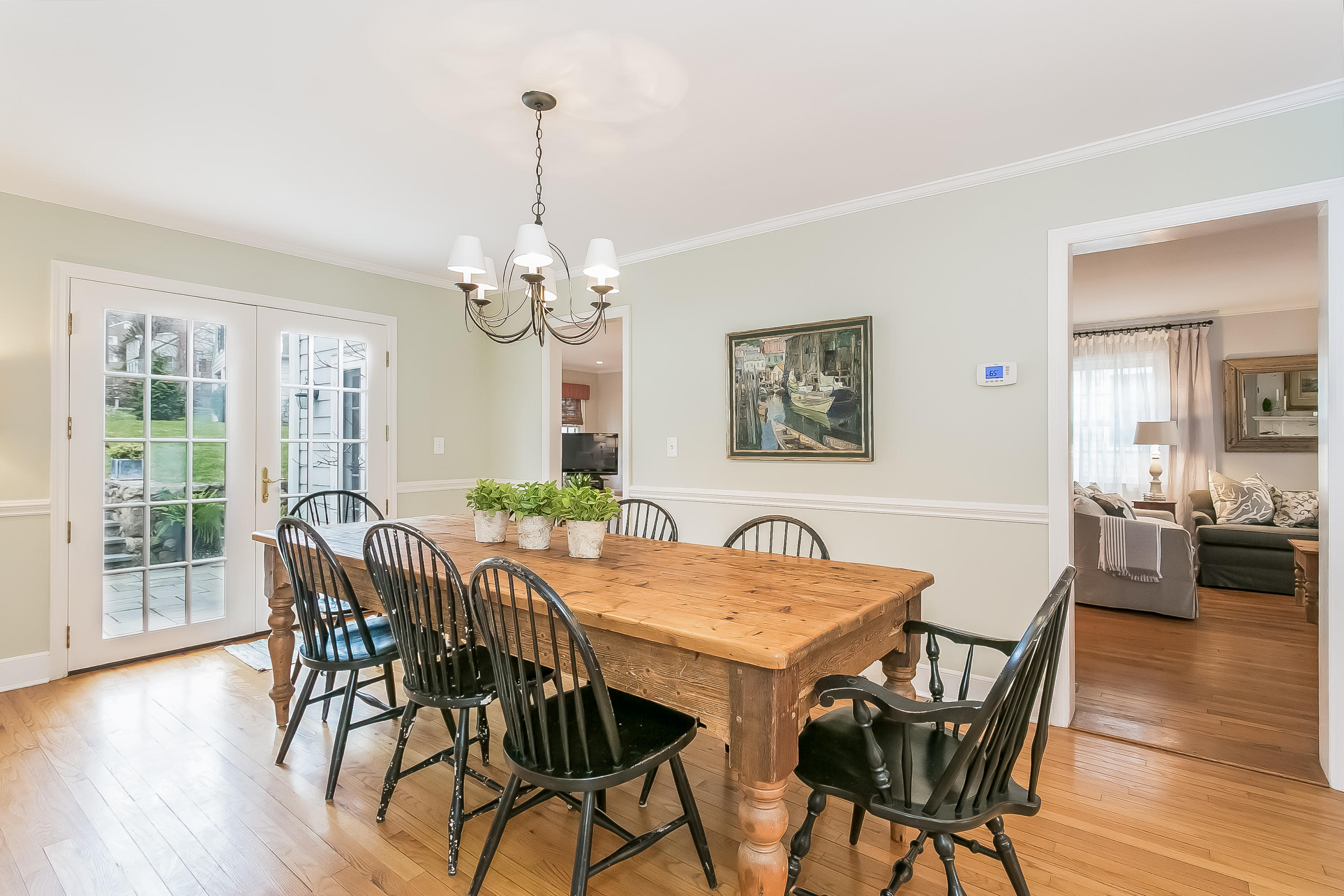 2 Miller Road Darien, CT 06820 - Photo 7 of 28 a view of a dining room with furniture wooden floor and chandelier