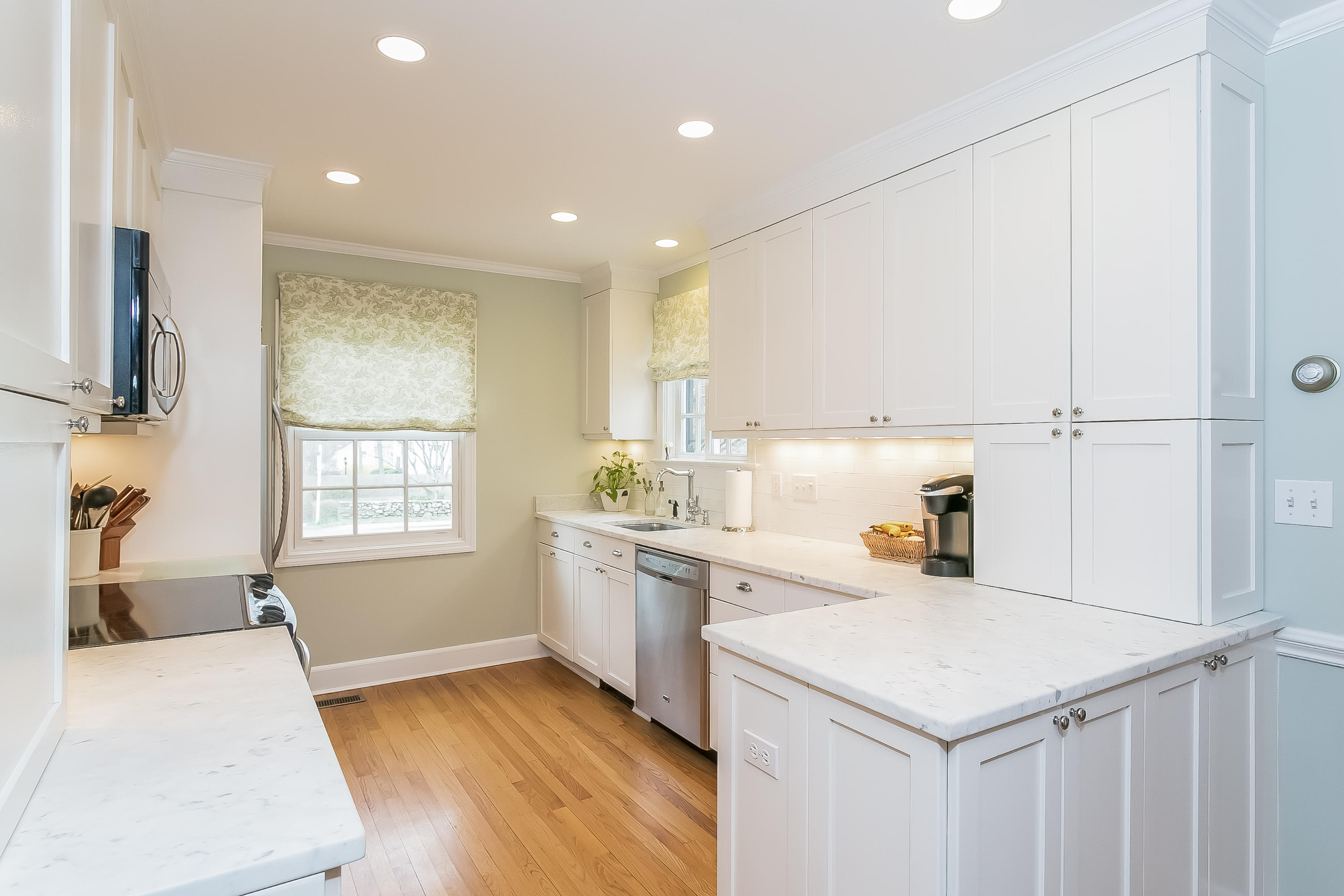2 Miller Road Darien, CT 06820 - Photo 8 of 28 a kitchen with a sink a stove cabinets and a refrigerator