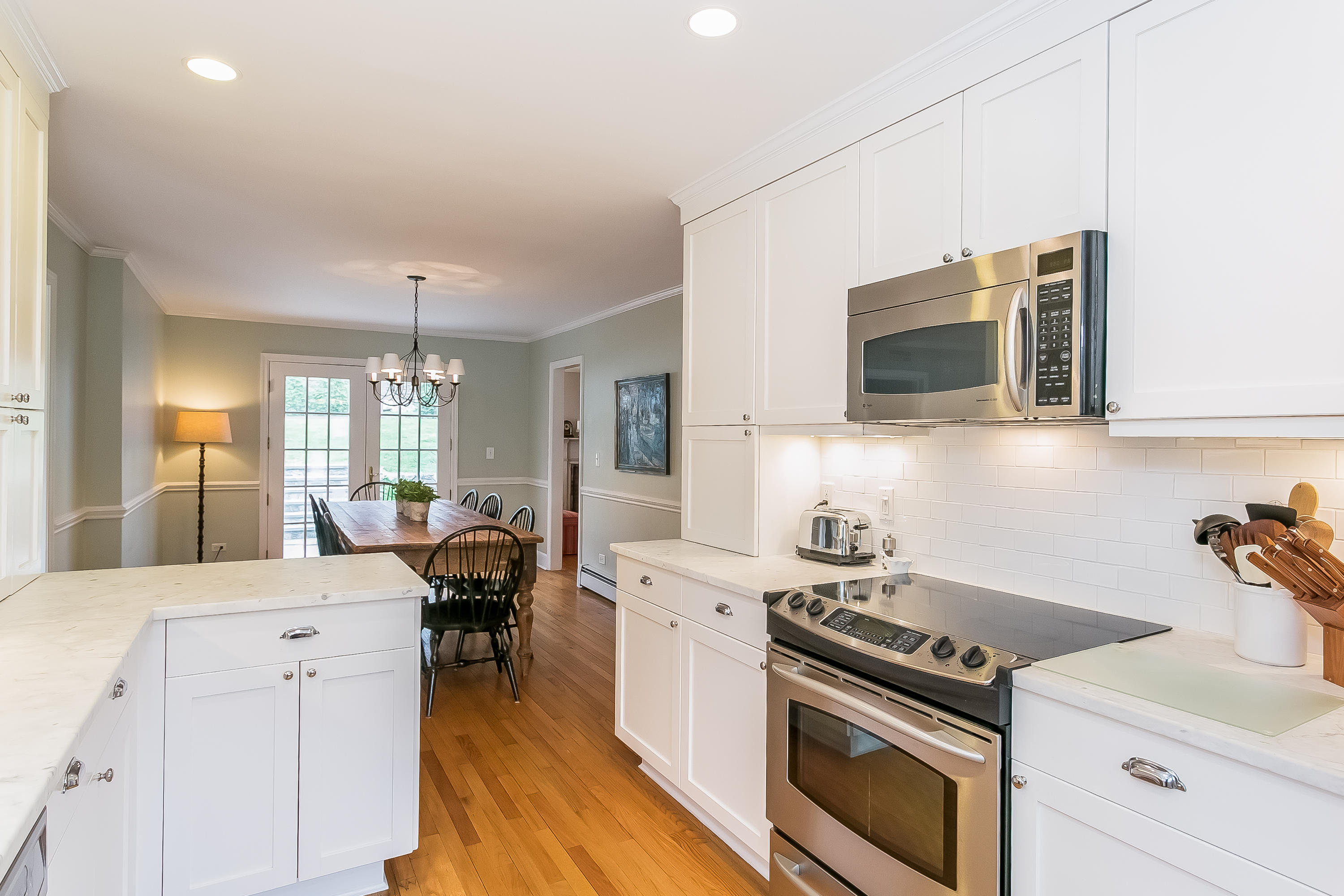 2 Miller Road Darien, CT 06820 - Photo 9 of 28 a kitchen with a stove a sink and a microwave