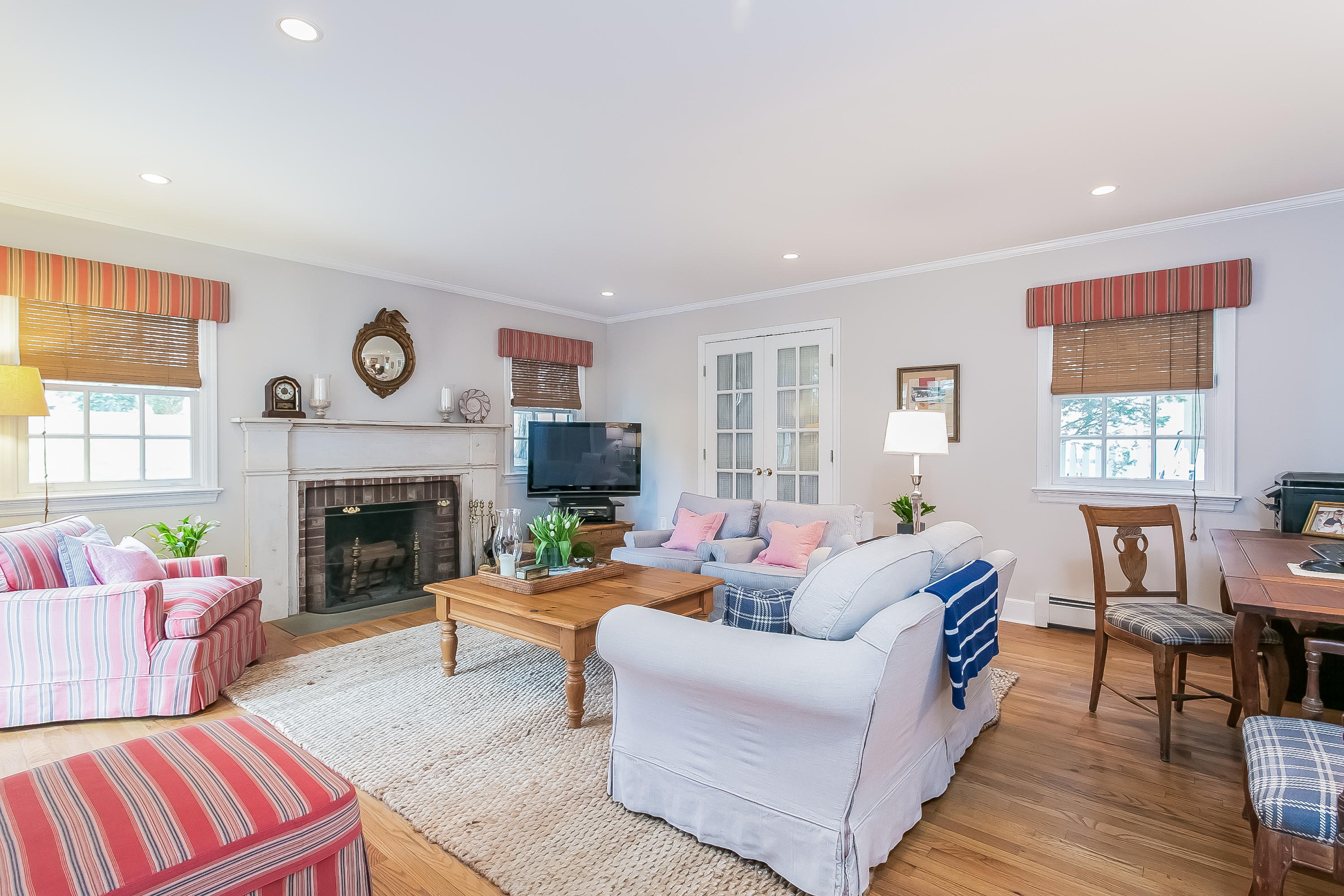 2 Miller Road Darien, CT 06820 - Photo 10 of 28 a living room with furniture and a fireplace