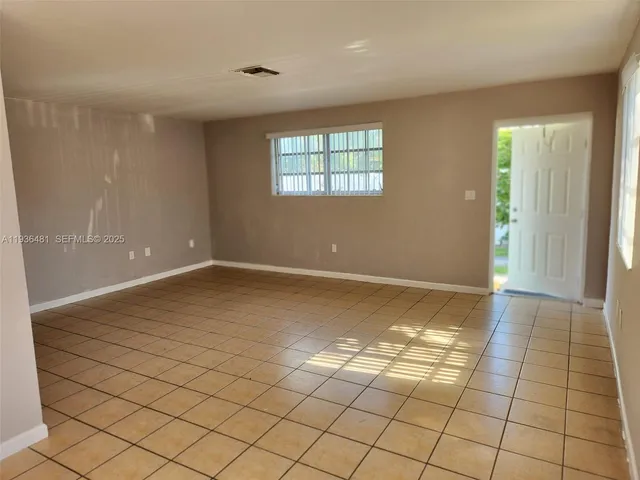 a view of an empty room and window