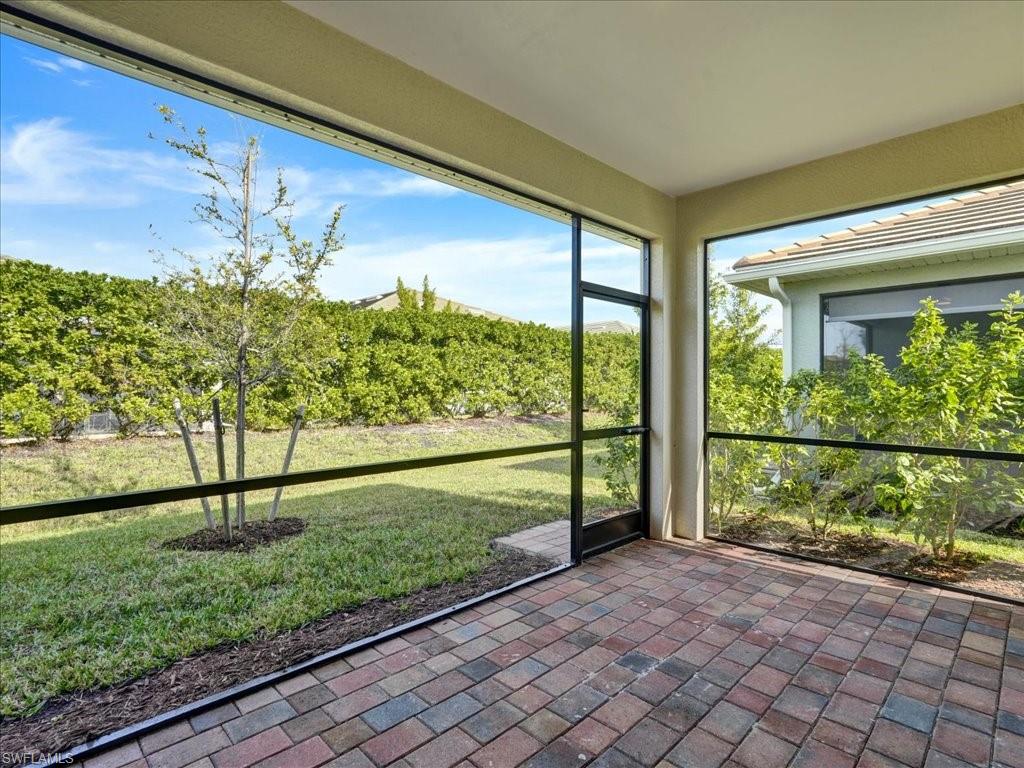 999 Enbrook Loop Naples, FL 34114 - Photo 16 of 50 a view of a yard from a balcony