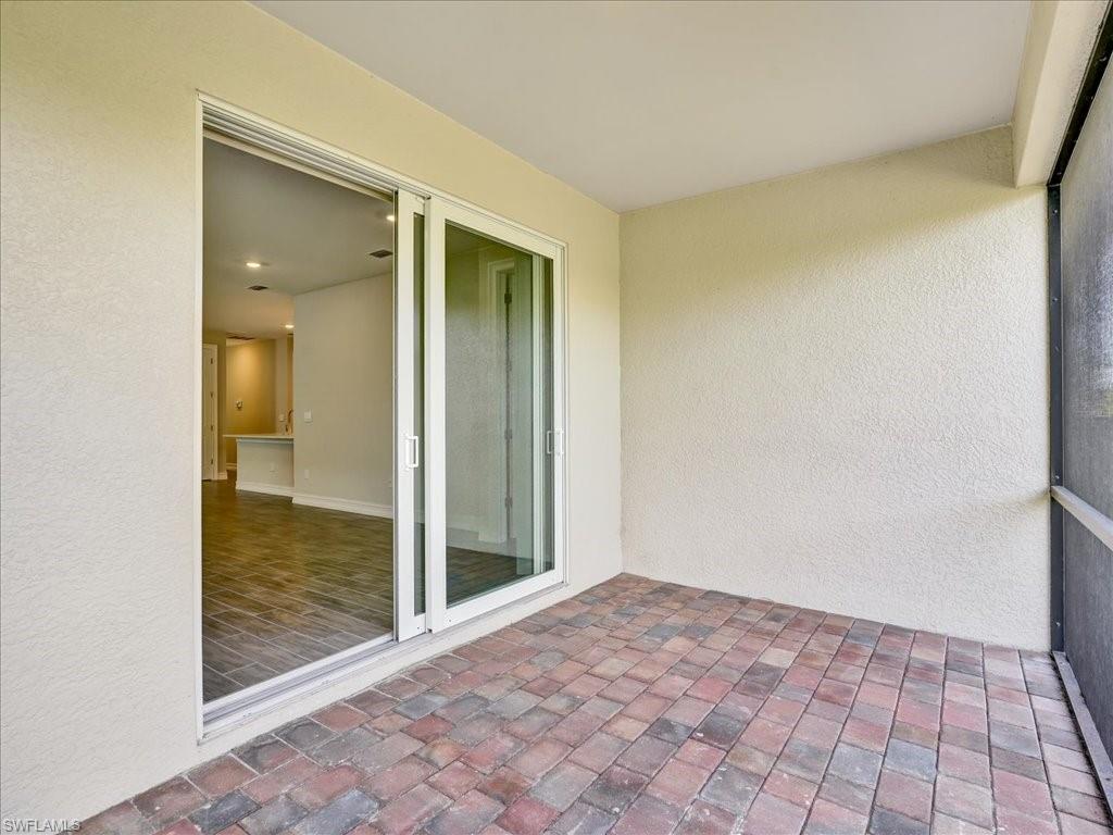 999 Enbrook Loop Naples, FL 34114 - Photo 19 of 50 a view of a hallway to a room